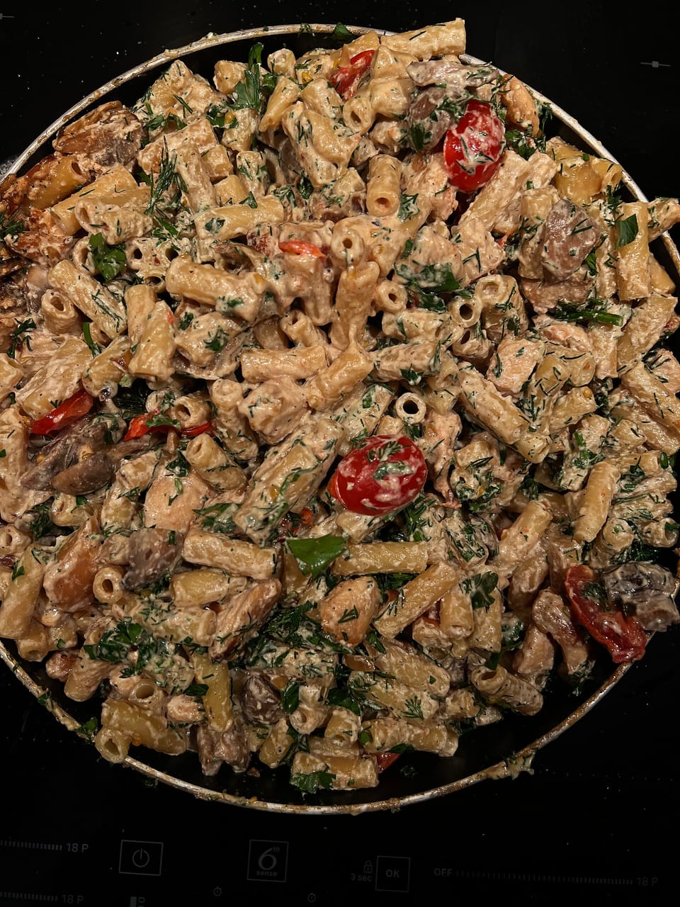 Creamy mushroom & tomato pasta — illustrative photograph